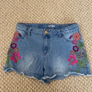 Cat & Jack kids size XL (14/16). Denim shorts with floral detail on sides.